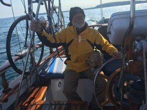 Note next to Jim's right hand:  everything must have dual purposes.  Bike bottle holder and pedal baskets are also cockpit coffee cup holders.